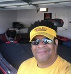 Man standing in front of recreational vehicle taking selfie